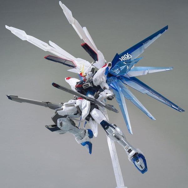 Bandai MG 1/100 Gundam Base Limited Freedom Gundam Ver.2.0 [Clear Color] action pose with weapon. 